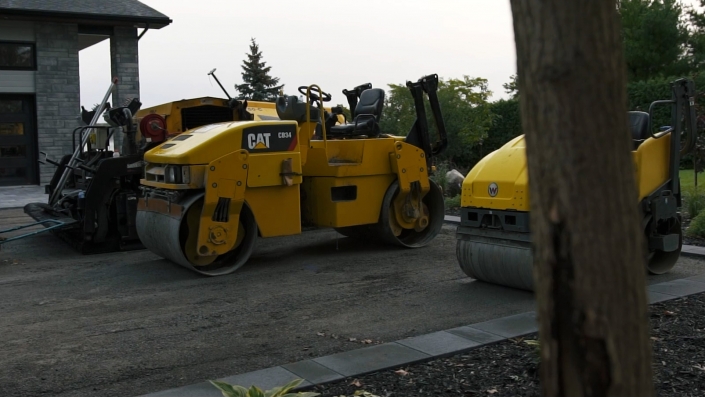 Asphalte JRL Paving residential driveway skid-steer and roller equipment